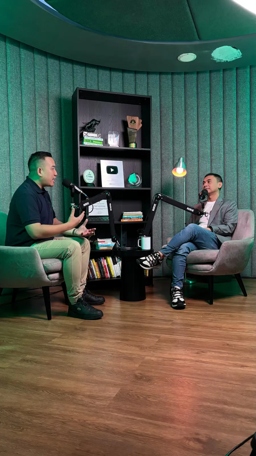 William Ndut speaking on stage — moment 03