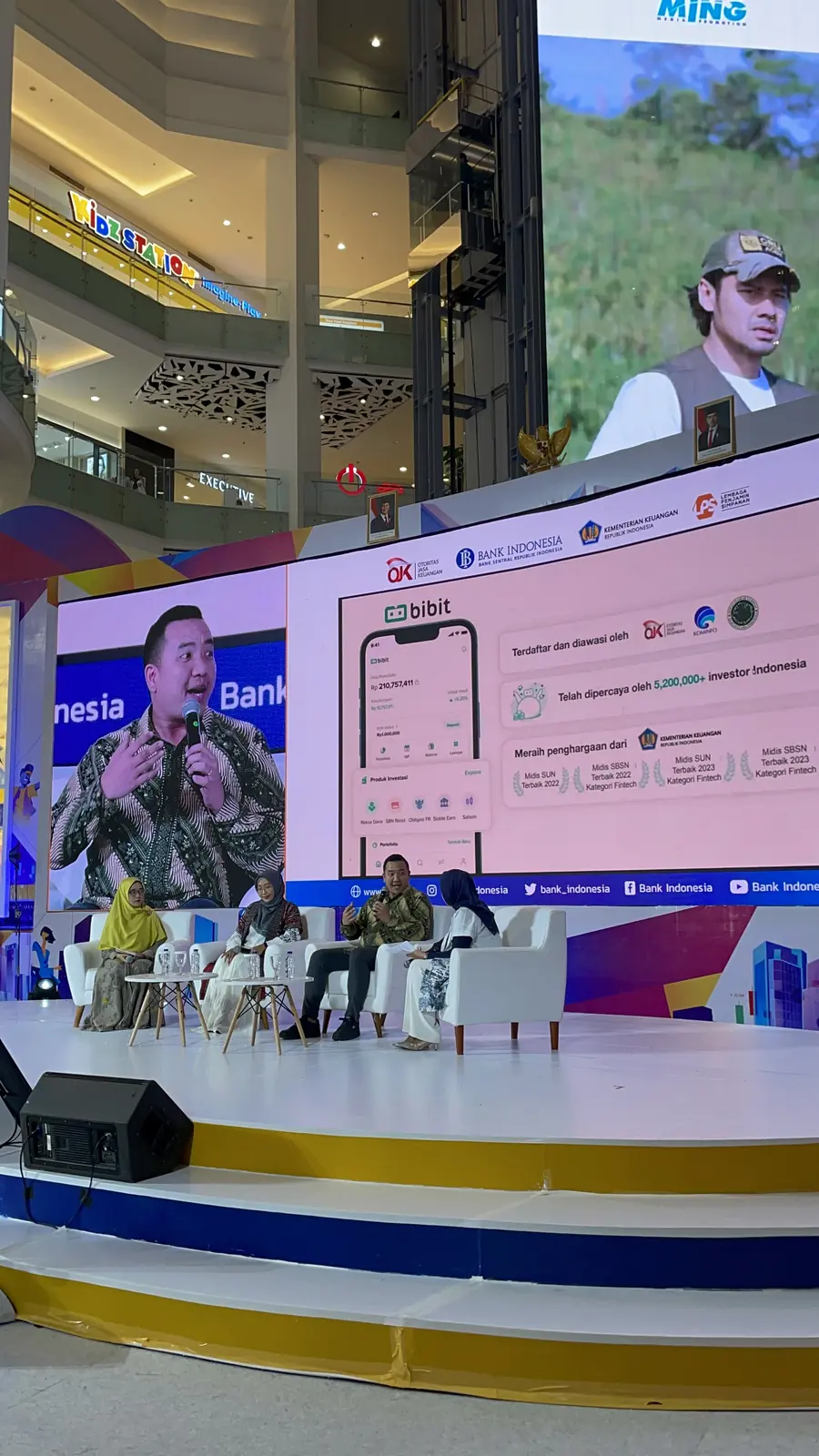 William Ndut speaking on stage — moment 11