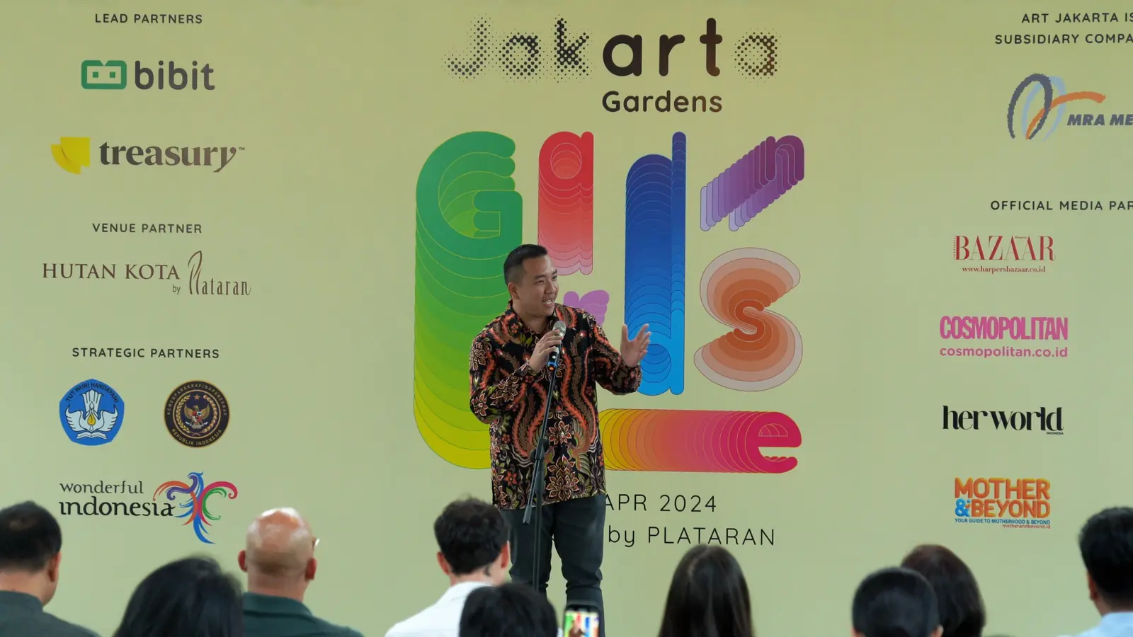 William Ndut speaking on stage — moment 29